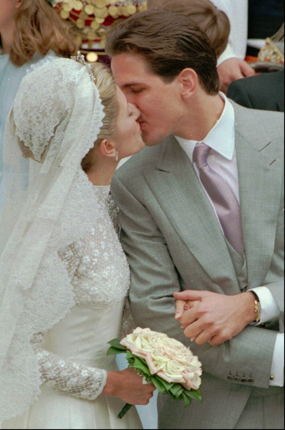 Crown Prince Pavlos of Greece kisses his new bride Marie-Chantal following their wedding at the Greek Cathedral in London, Saturday, July 1, 1995.